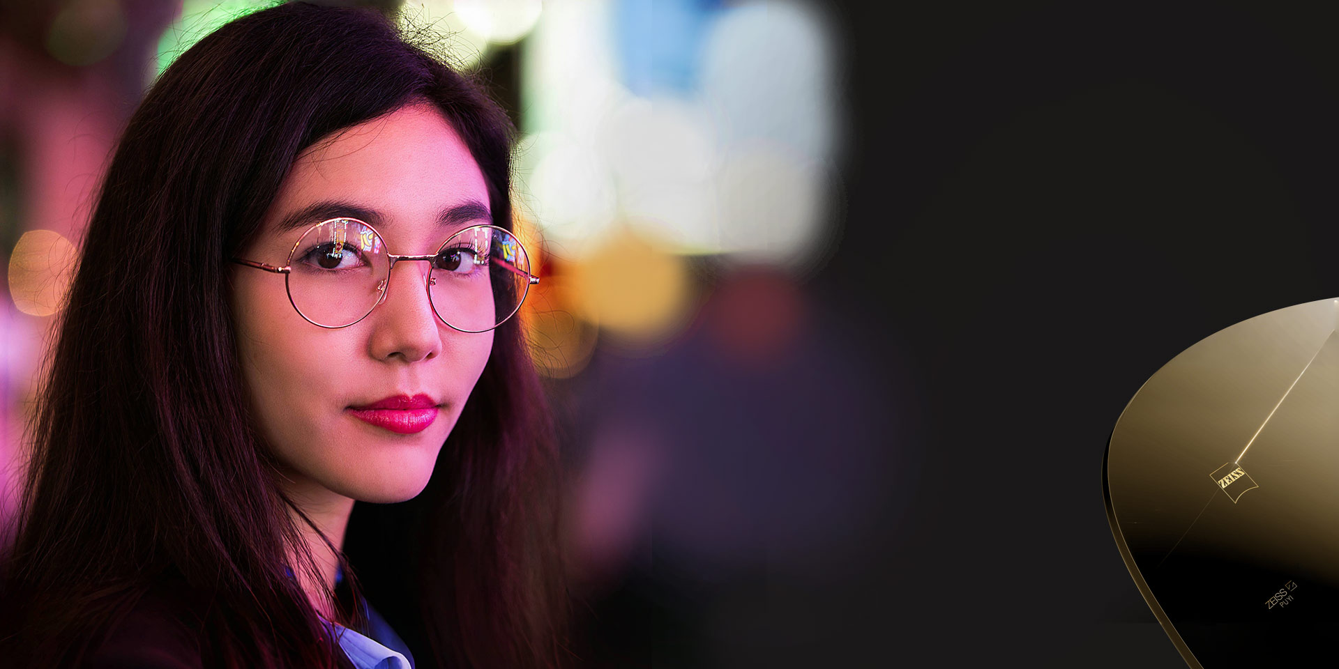 A young Asian woman wearing ZEISS LuminArt PRO lenses.