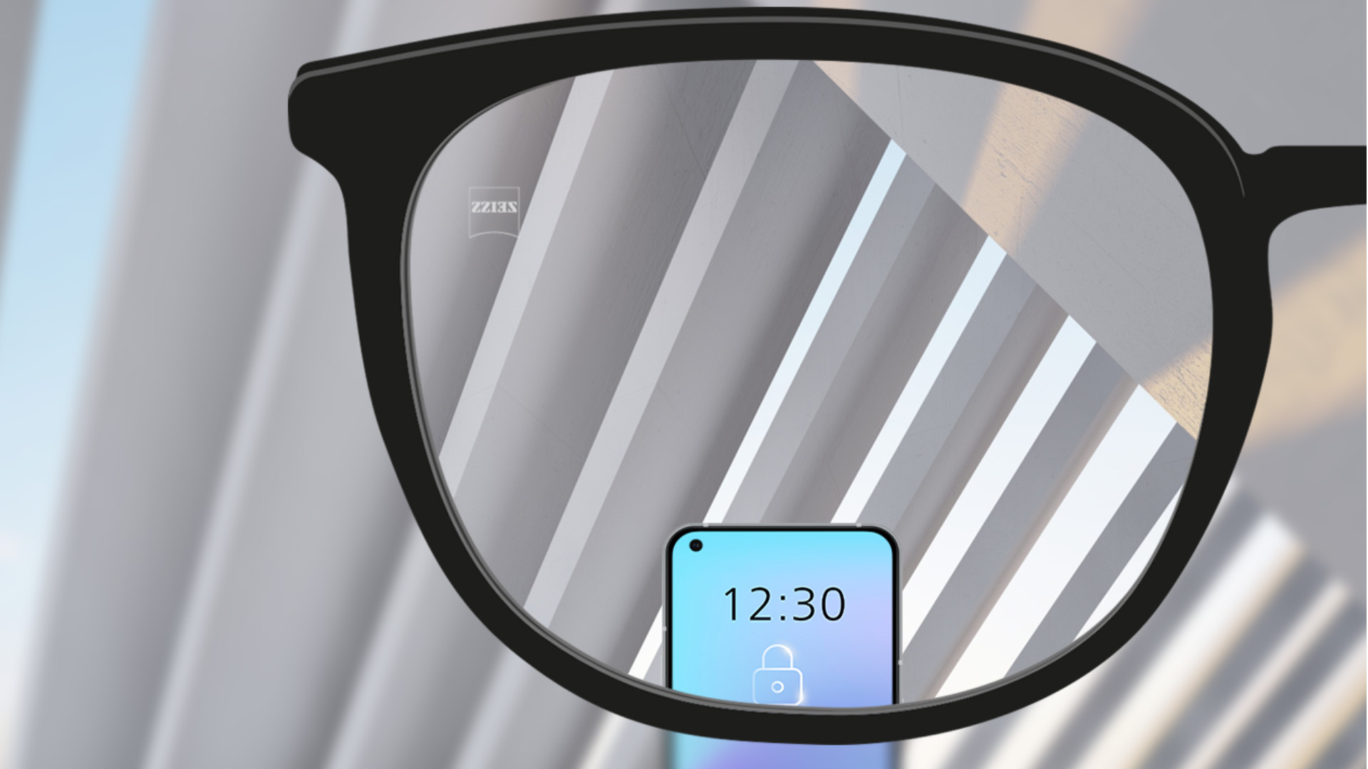 A point of view image with ZEISS Single Vision SmartLife lenses with a smartphone and the lens being fully clear.