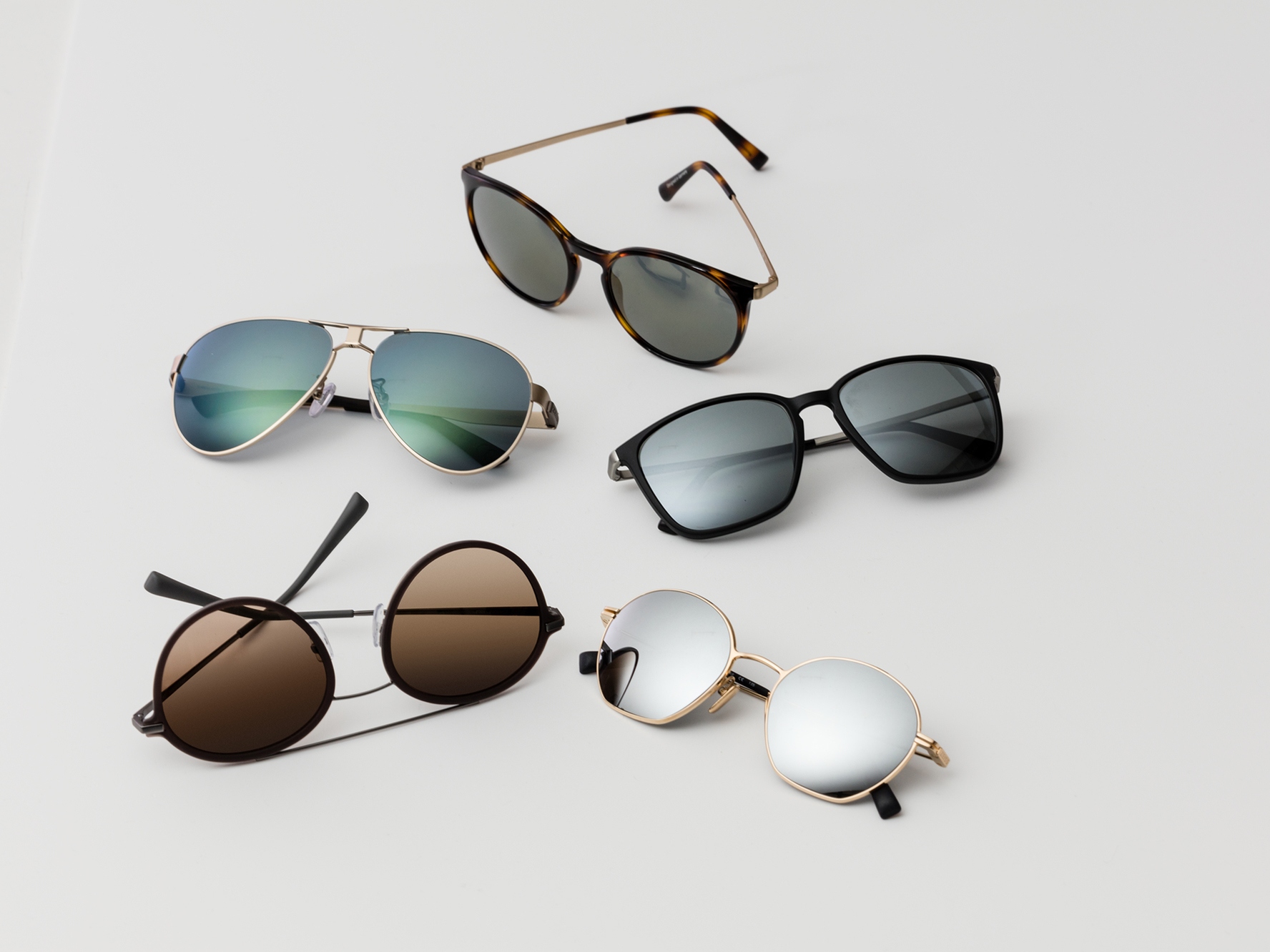Five pairs of sunglasses, showing the classical sun protection tints for medium to bright light conditions.