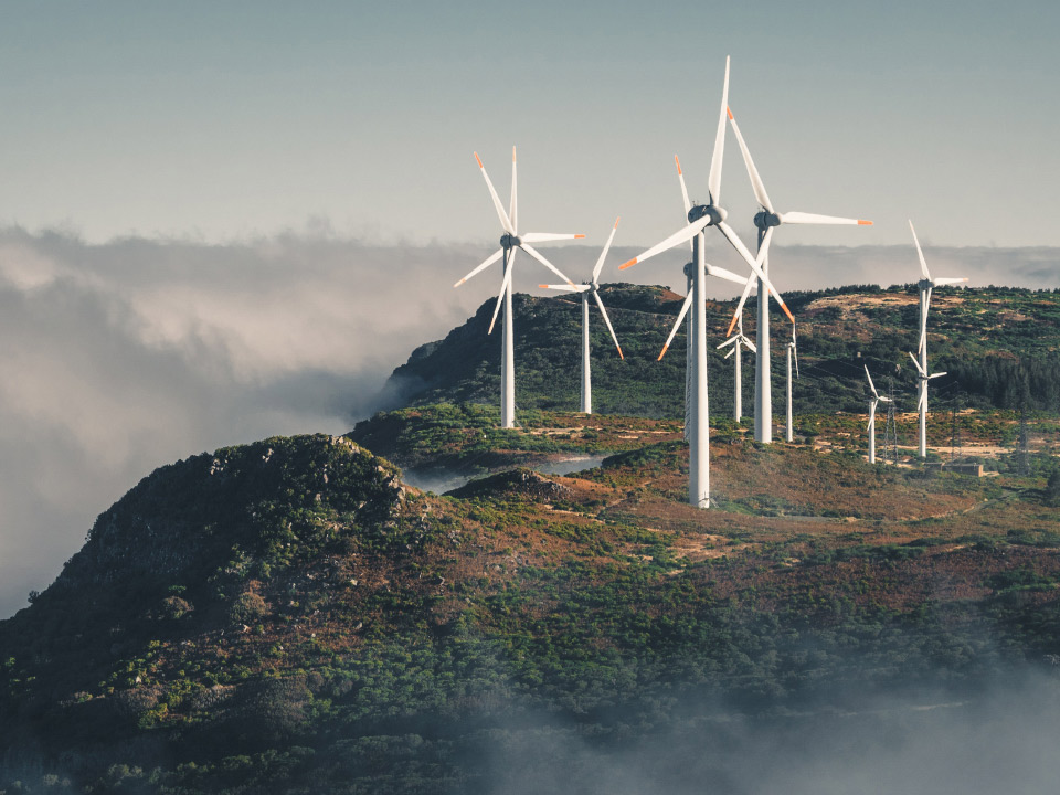 An image of wind turbines on a cliff. 