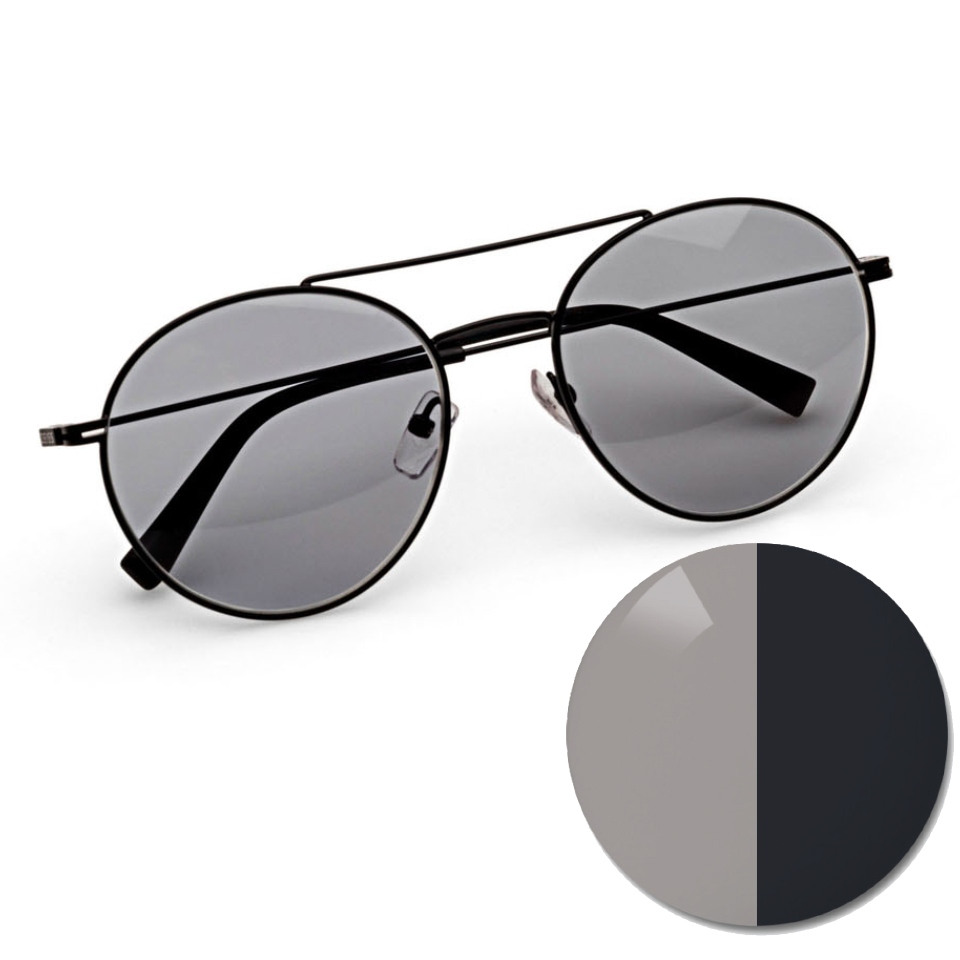 蔡司 AdaptiveSun 灰色眼鏡，顯示一個光線中的色點和深色染色色調